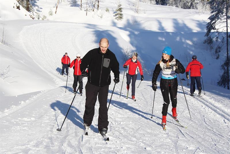 People skiing in the snow.