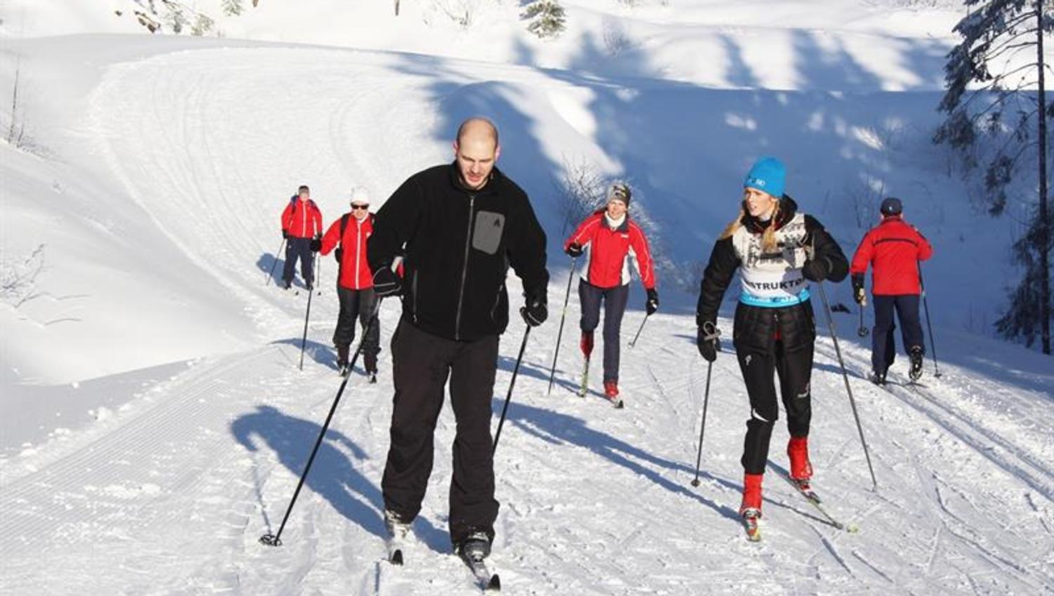 People skiing in the snow.