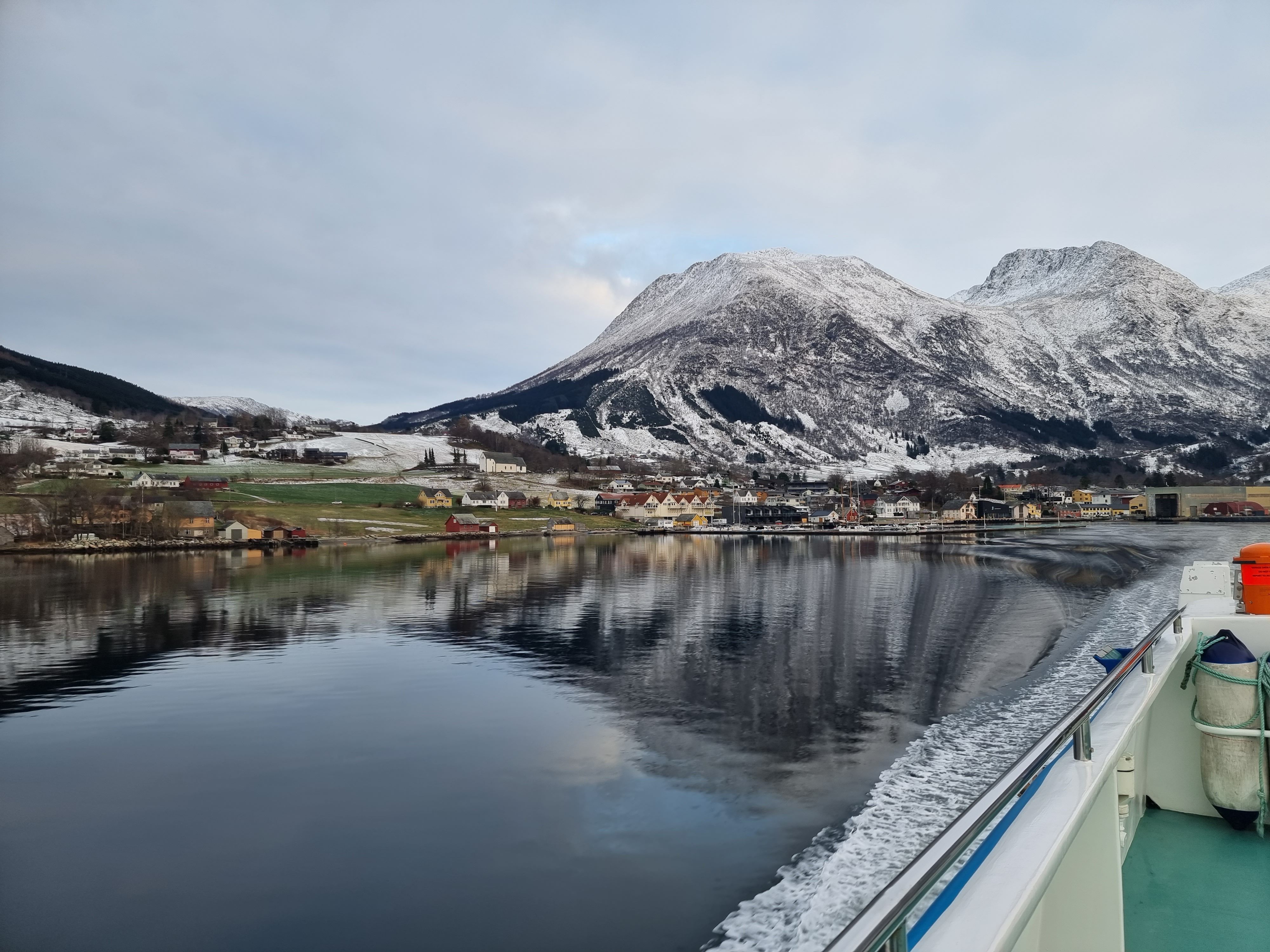Panoramic view of the fjord and mountains from Hardangerfjordekspressen on a sunny winter day.