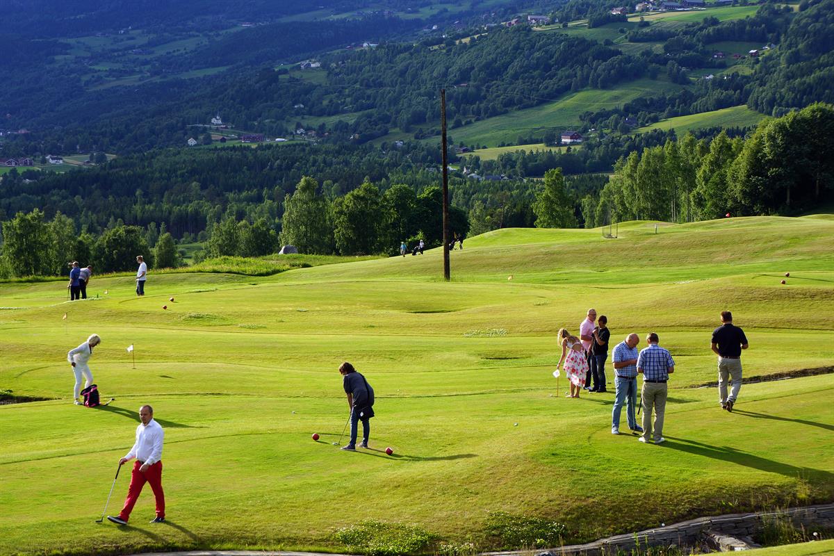 Golf players at the putting course at Nermo