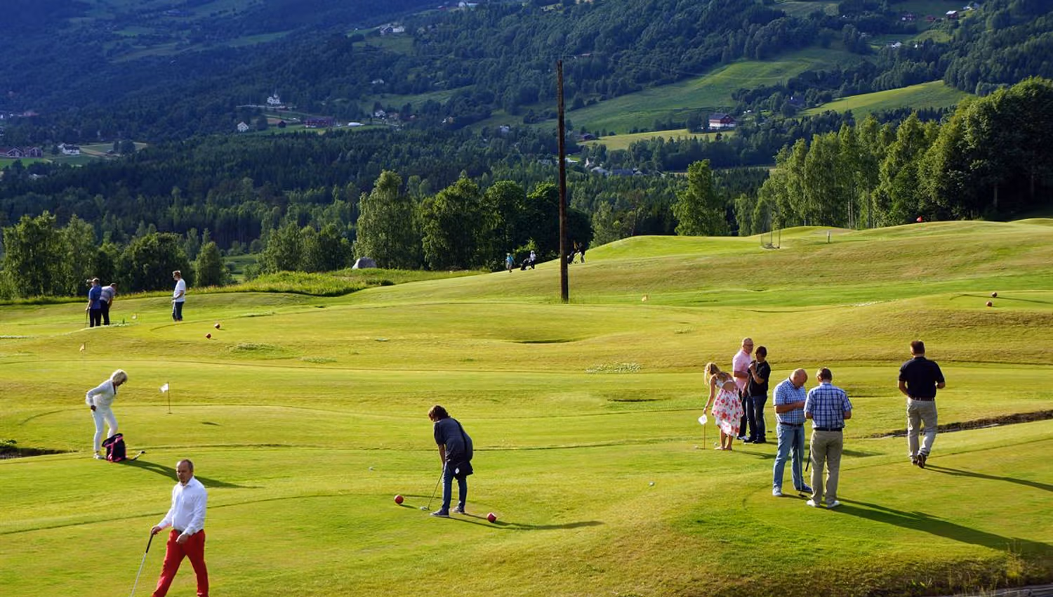 Golf players at the putting course at Nermo
