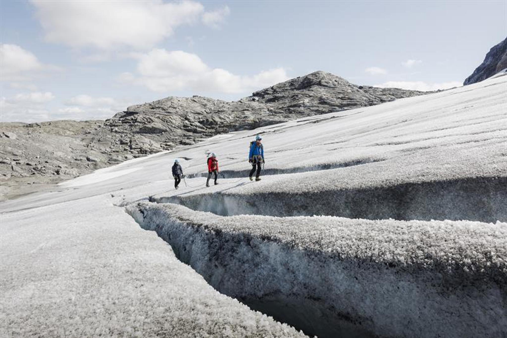people walk on glacier 
