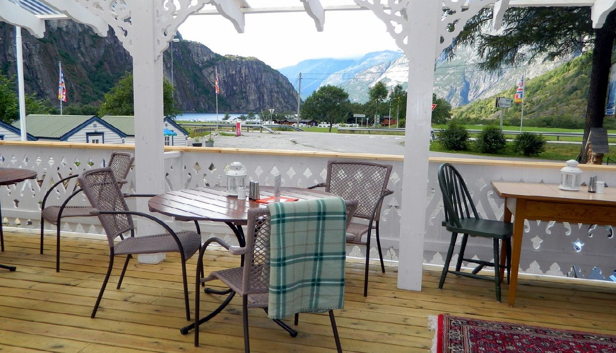 A terrace with tables and chairs for dining.