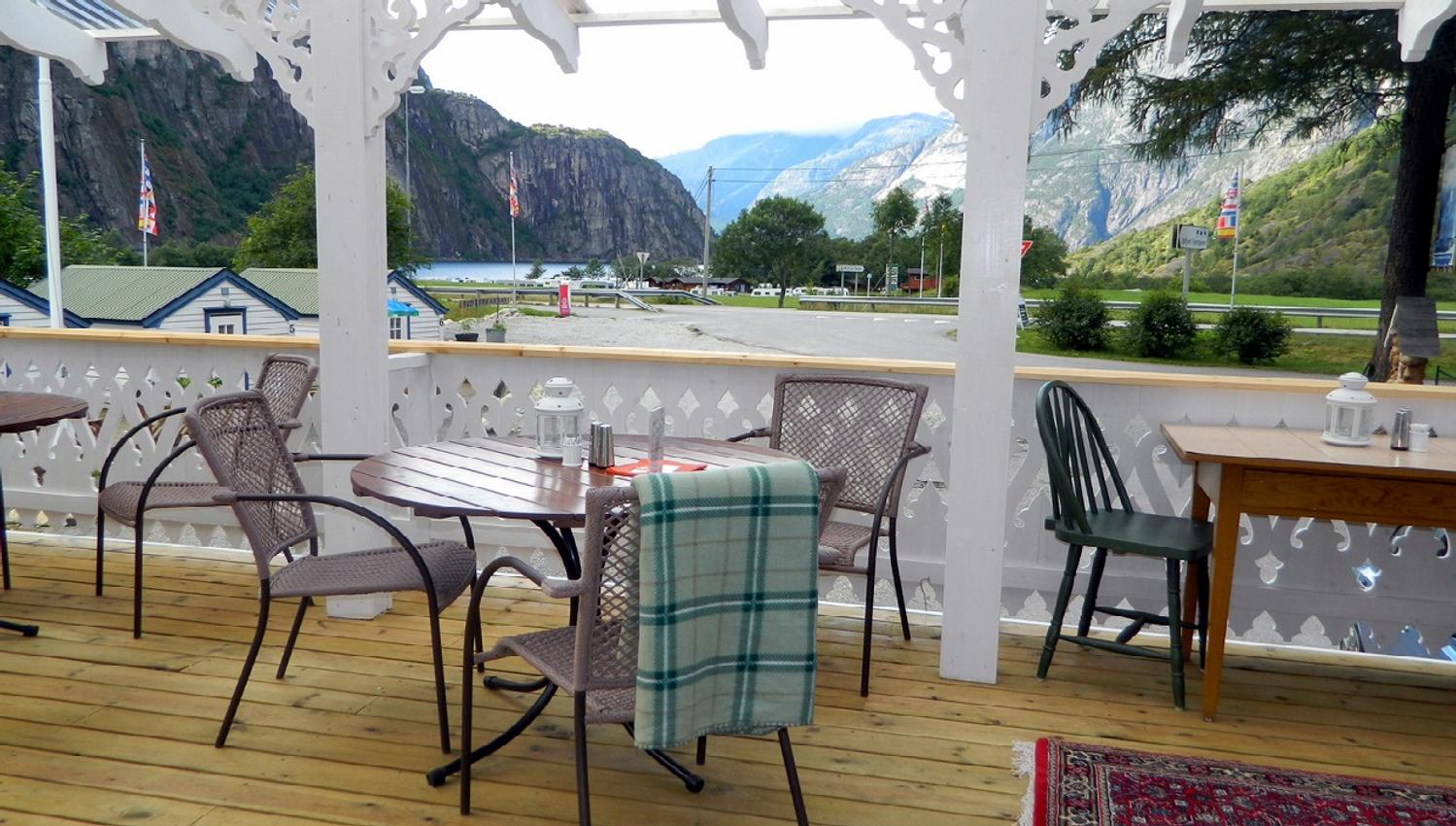 A terrace with tables and chairs for dining.