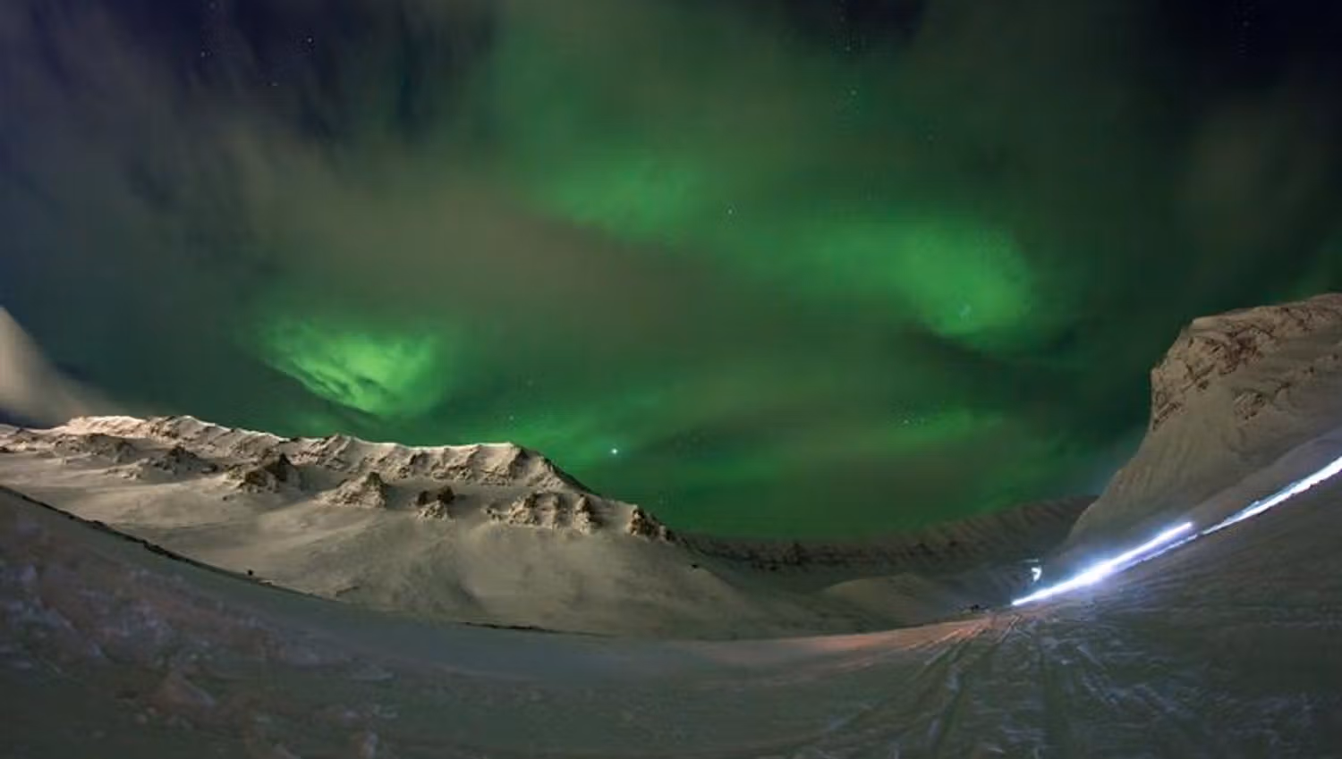 Northern Lights behind clouds
