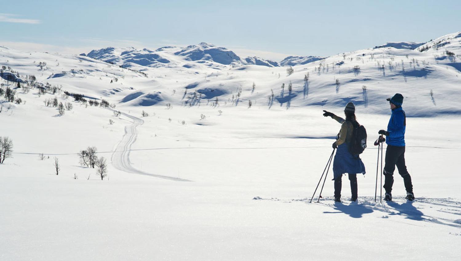 man and woman cross-country skiing at Rauland