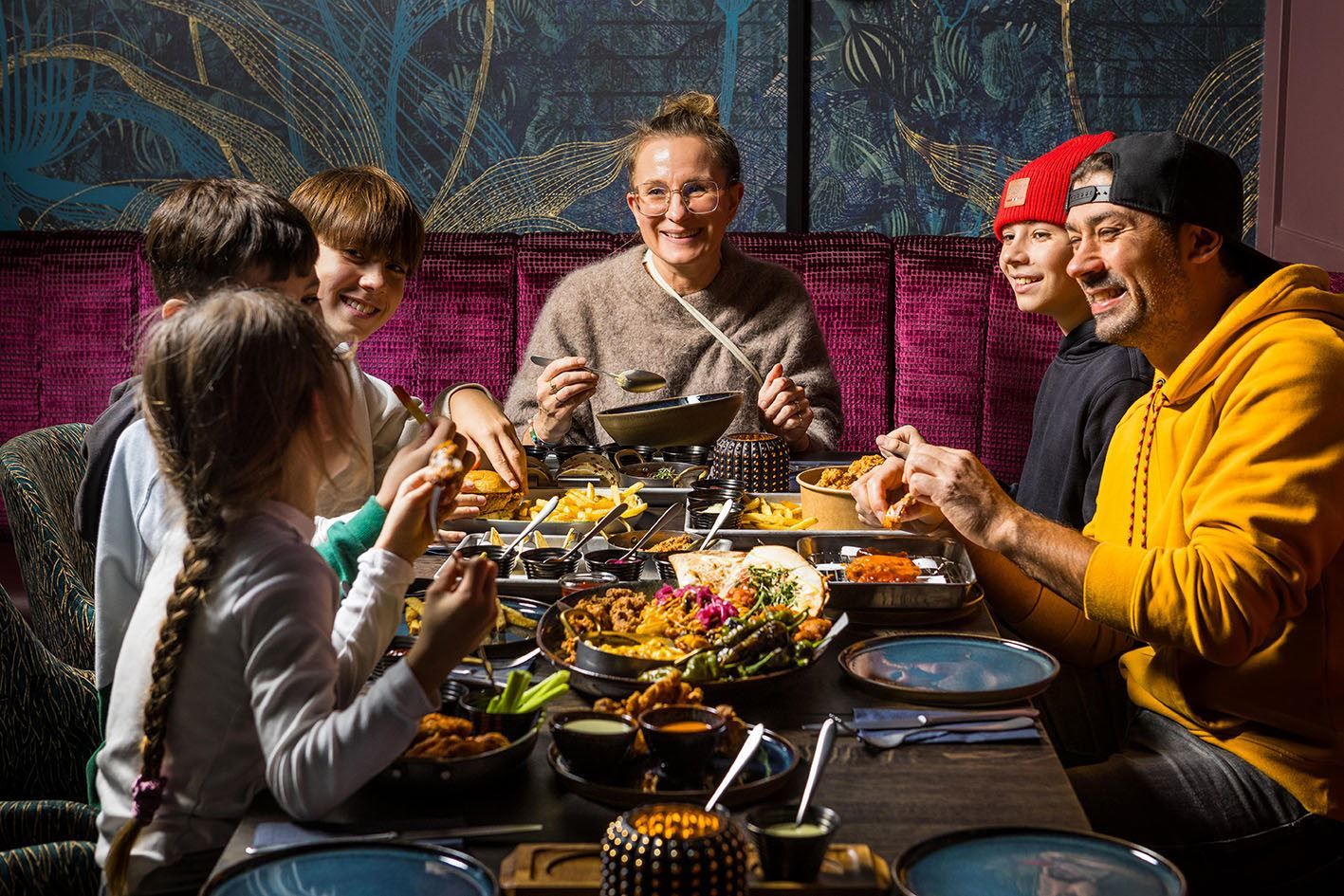 Guests sharing a meal at EPIC Tromsø.