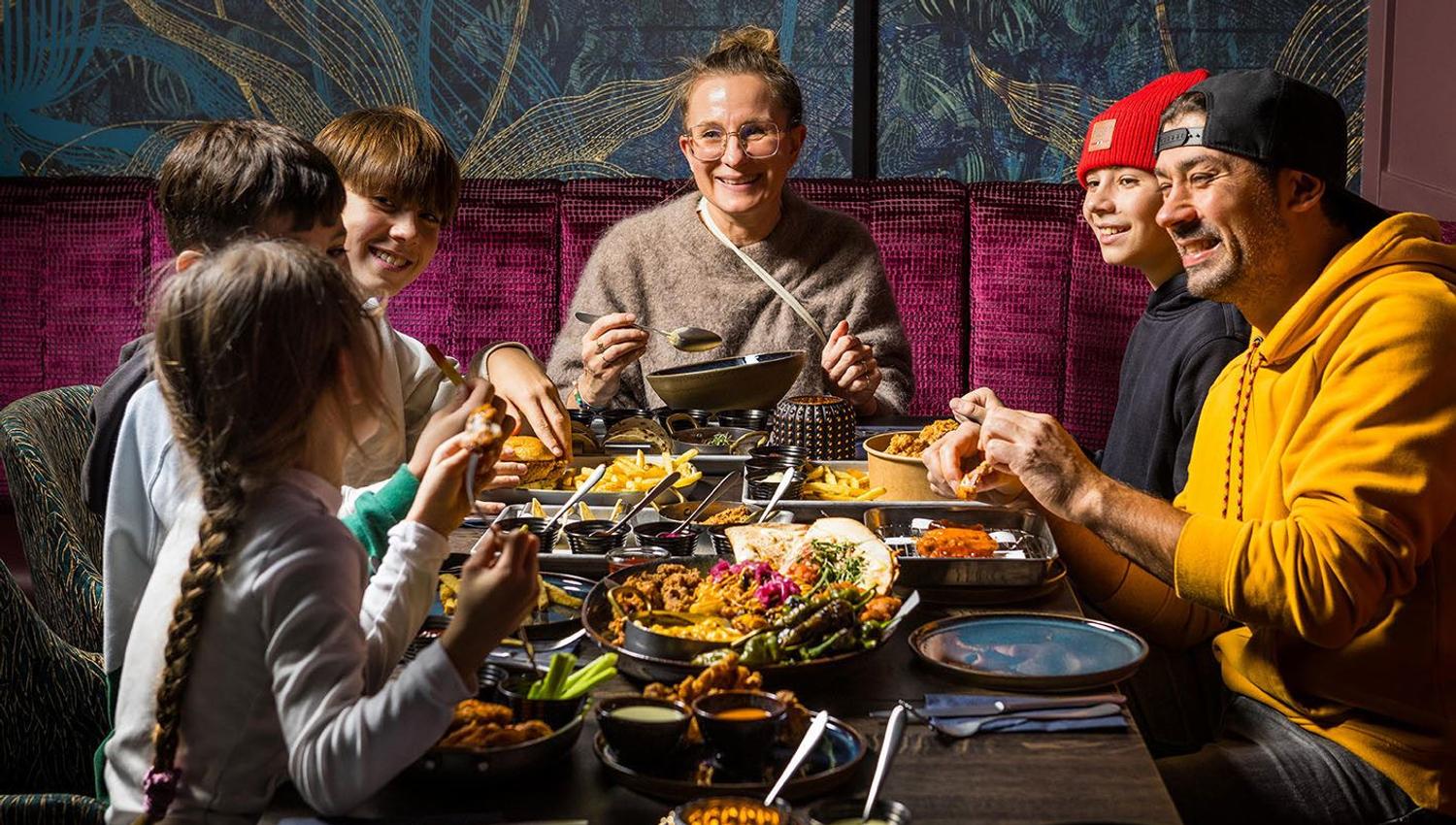 Guests sharing a meal at EPIC Tromsø.