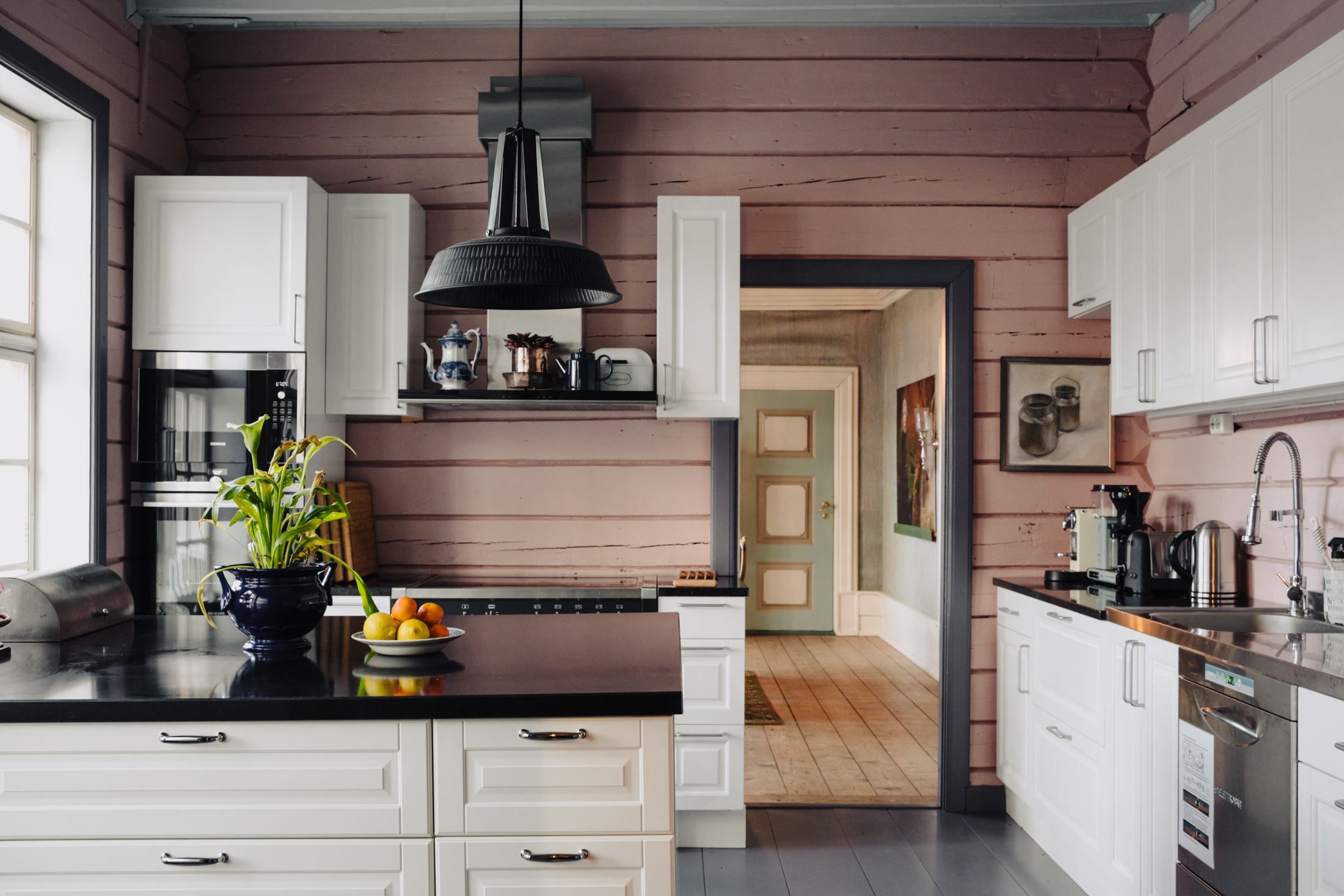 The modern and well-equipped kitchen at Skrivergaarden combines contemporary facilities with the historic character of the building.