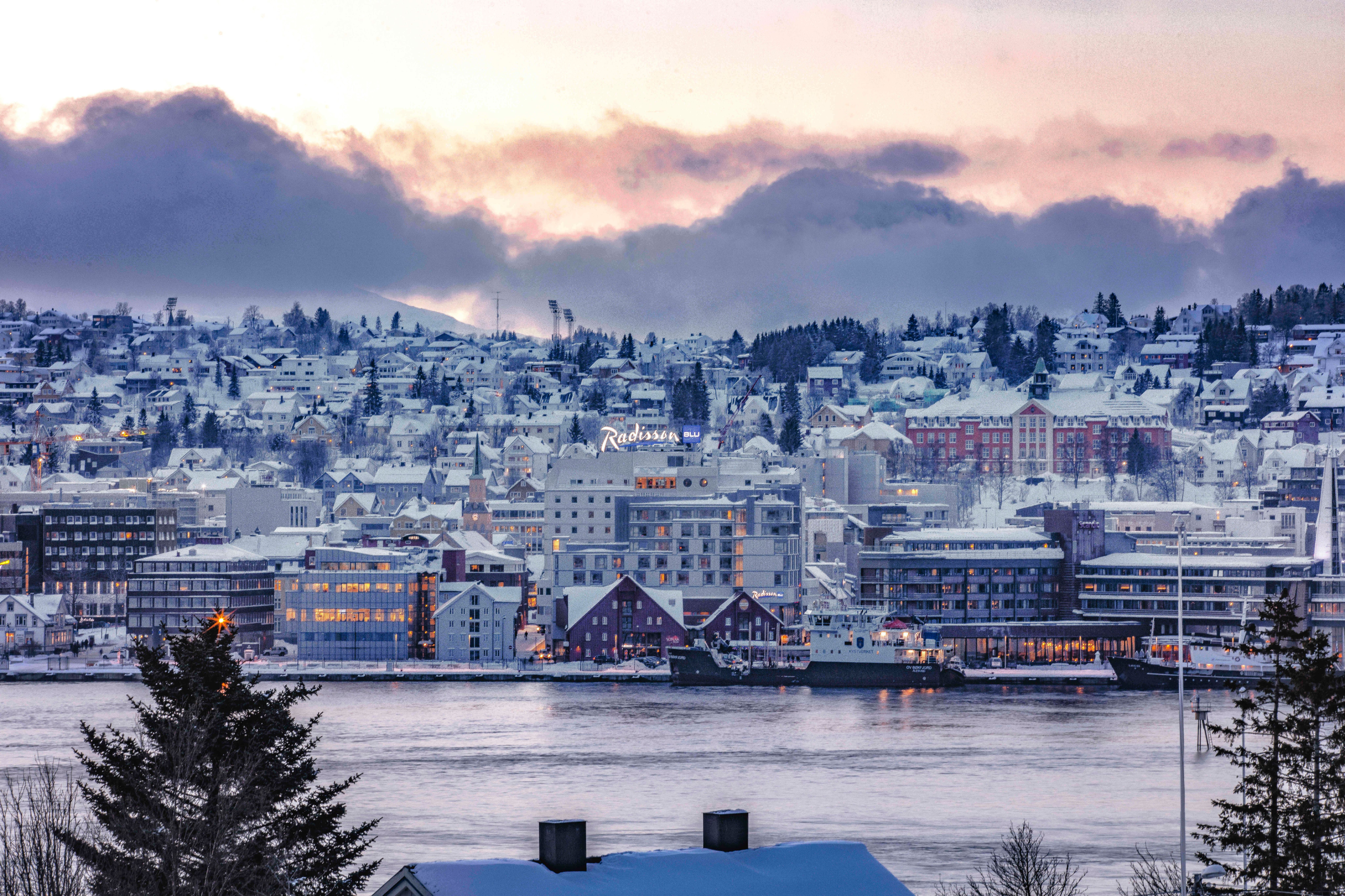 radisson Blu in wintertime with a water front and is blended in the city