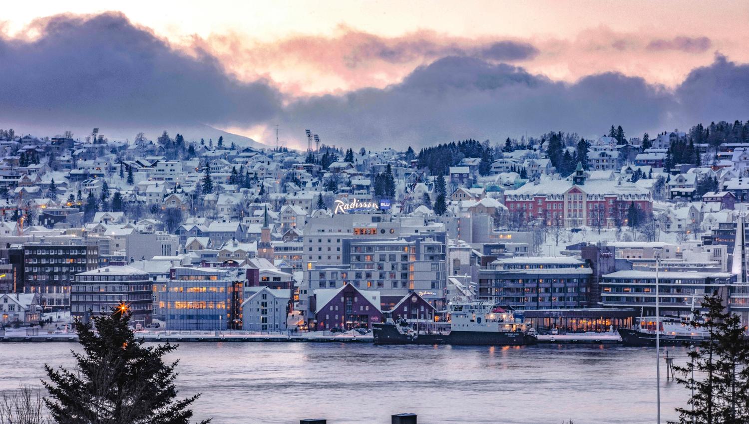 radisson Blu in wintertime with a water front and is blended in the city