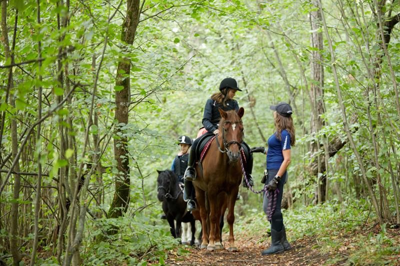 Girl on horse in the forest of Bygdø Kongsgård. Photo