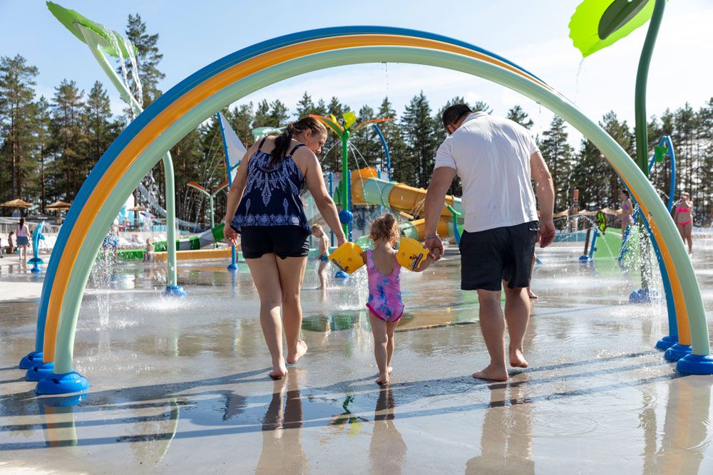 family with a small child in the splash park at Bø Sommarland