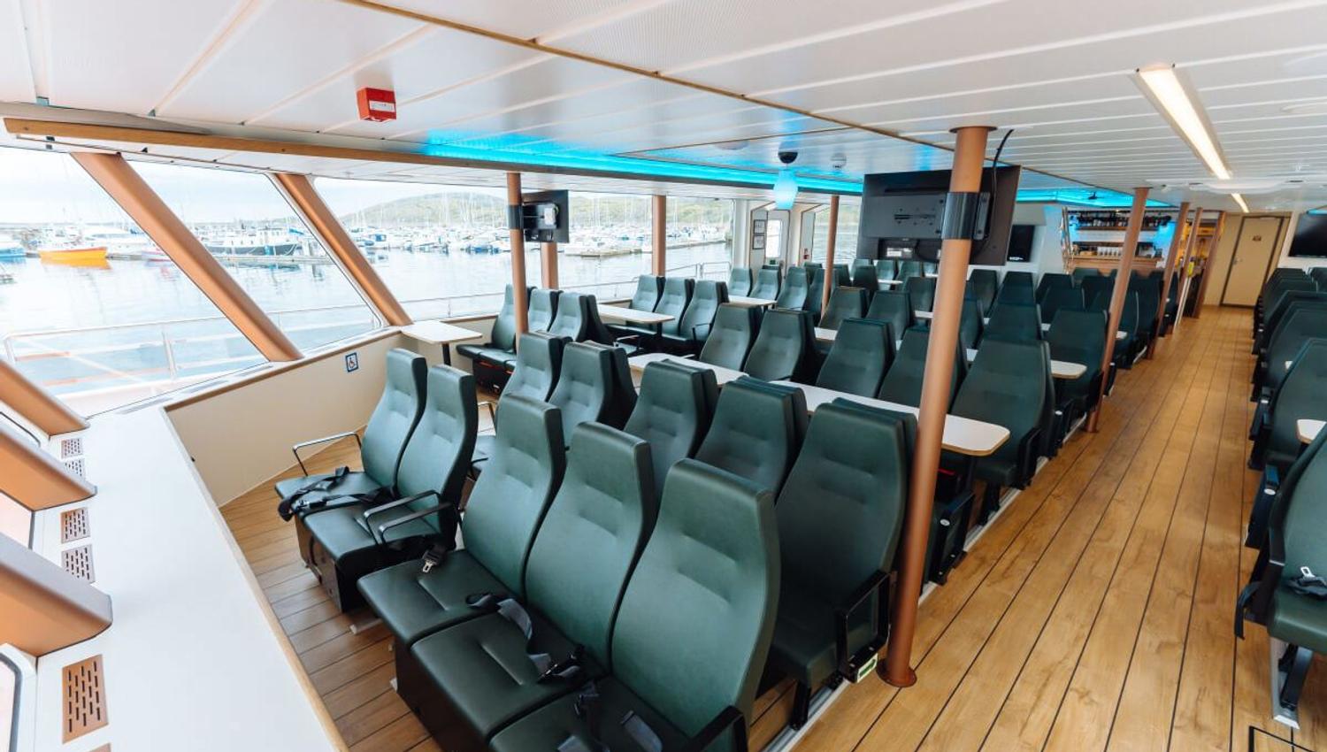 Side view of the catamaran's lounge with a view out of the windows