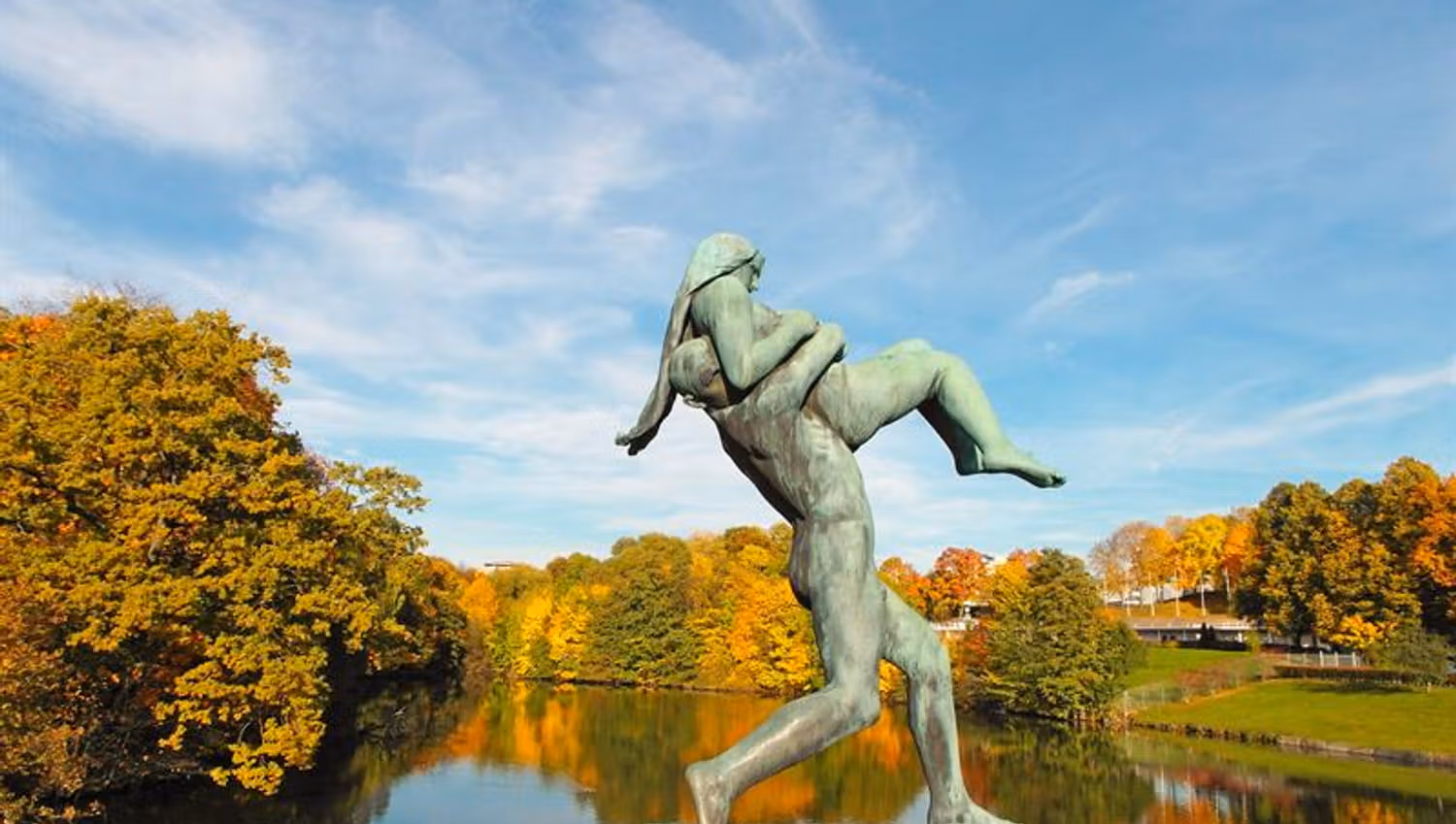 Statue on the bridge of a man carrying a woman.