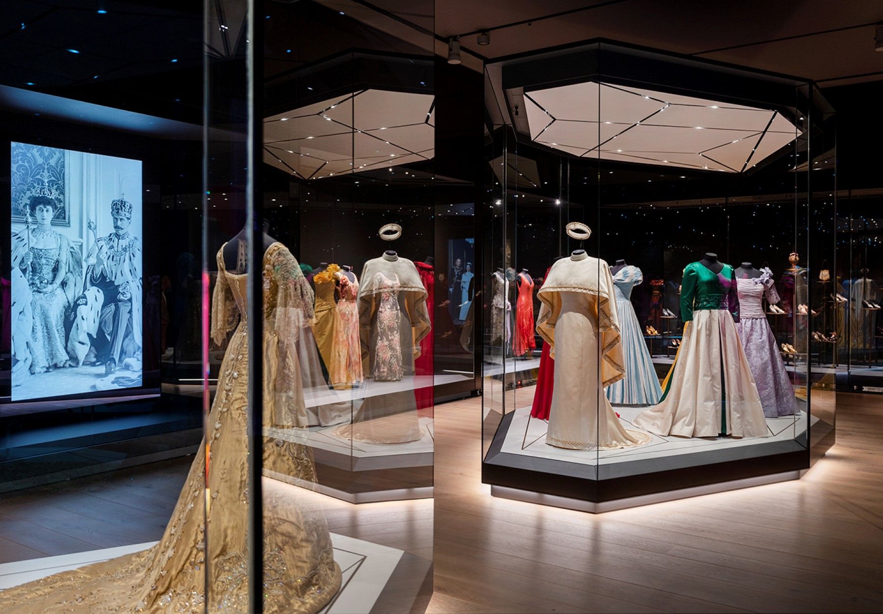 Various dresses on display in an exhibition.