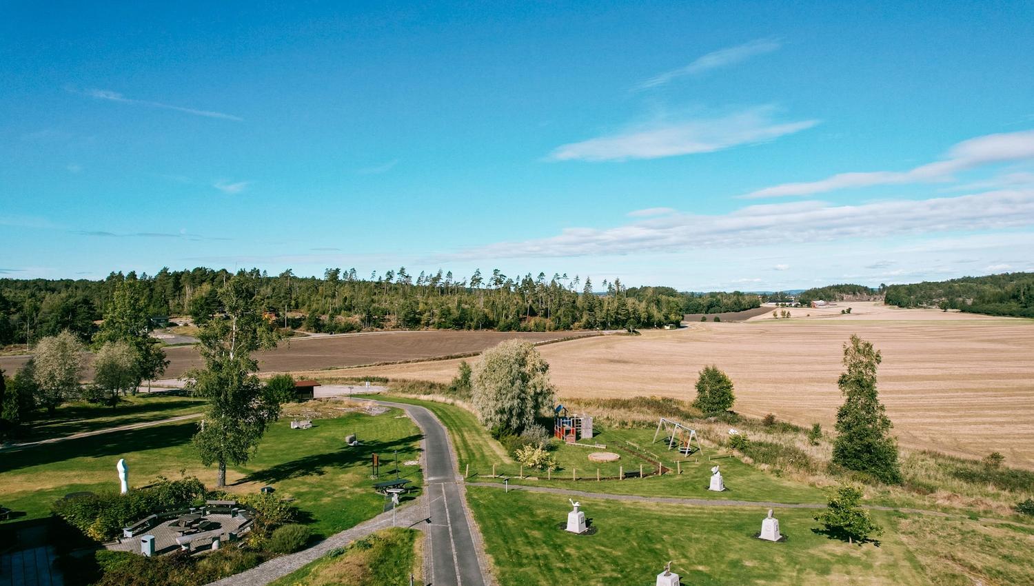 Drone image of the facility at Storedal Cultural Center and the surrounding fields. Photo.