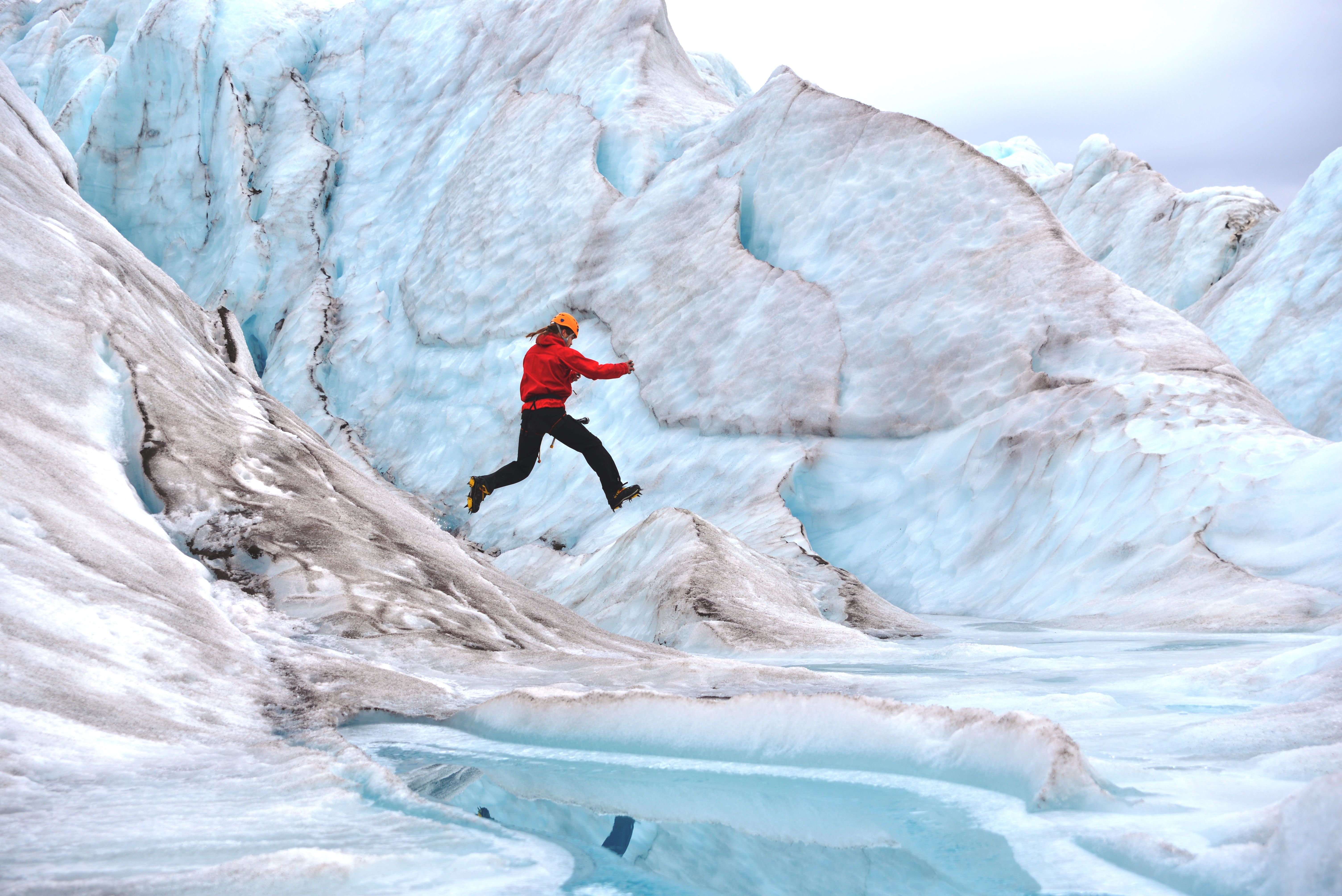 Person jumping on a glacier