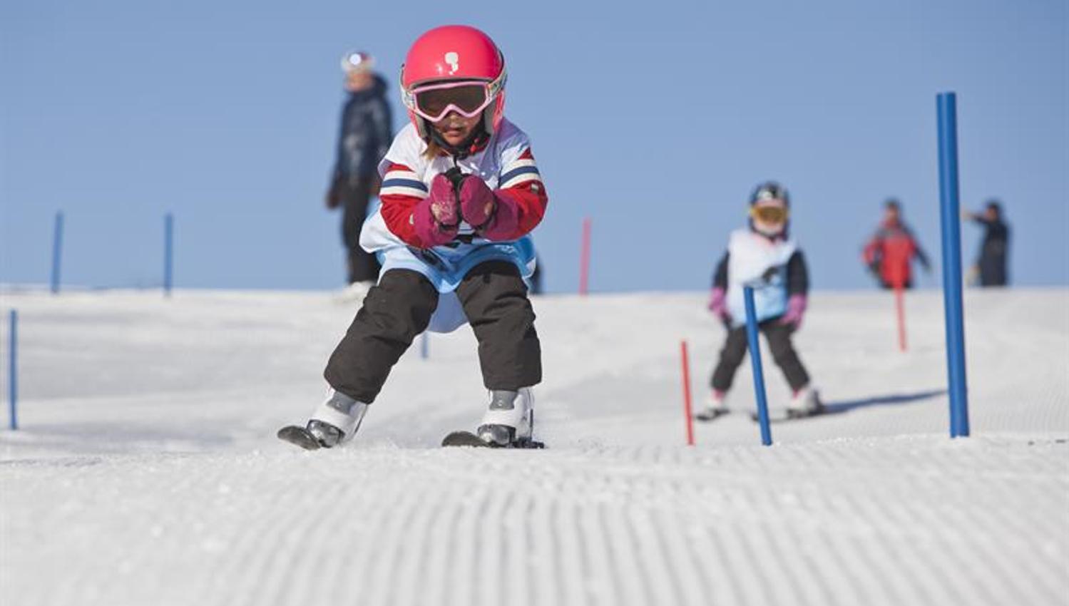 child in the ski school