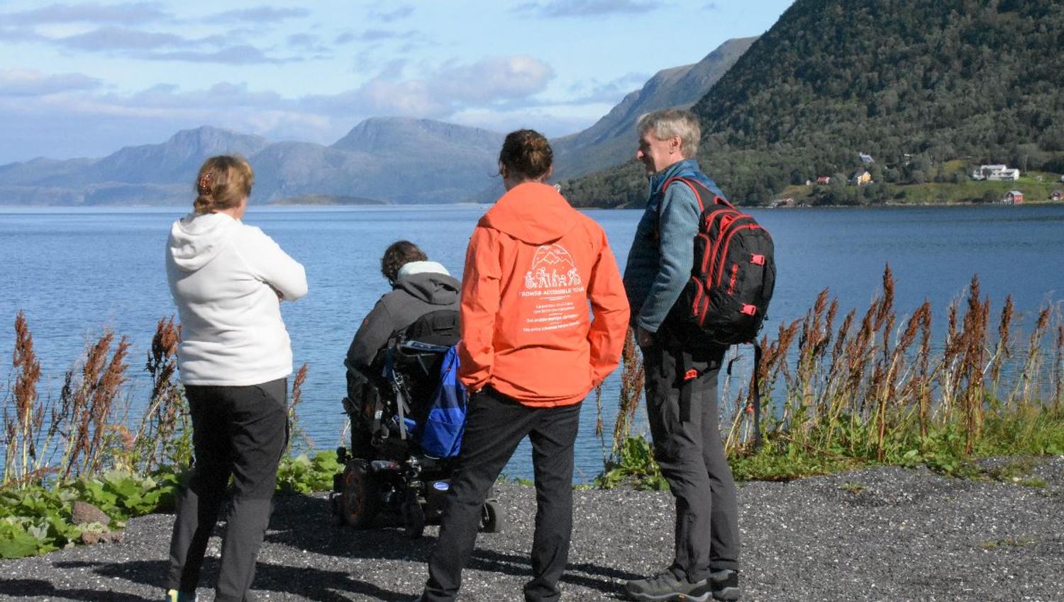Four guests enjoying the view of the sea and the mountains