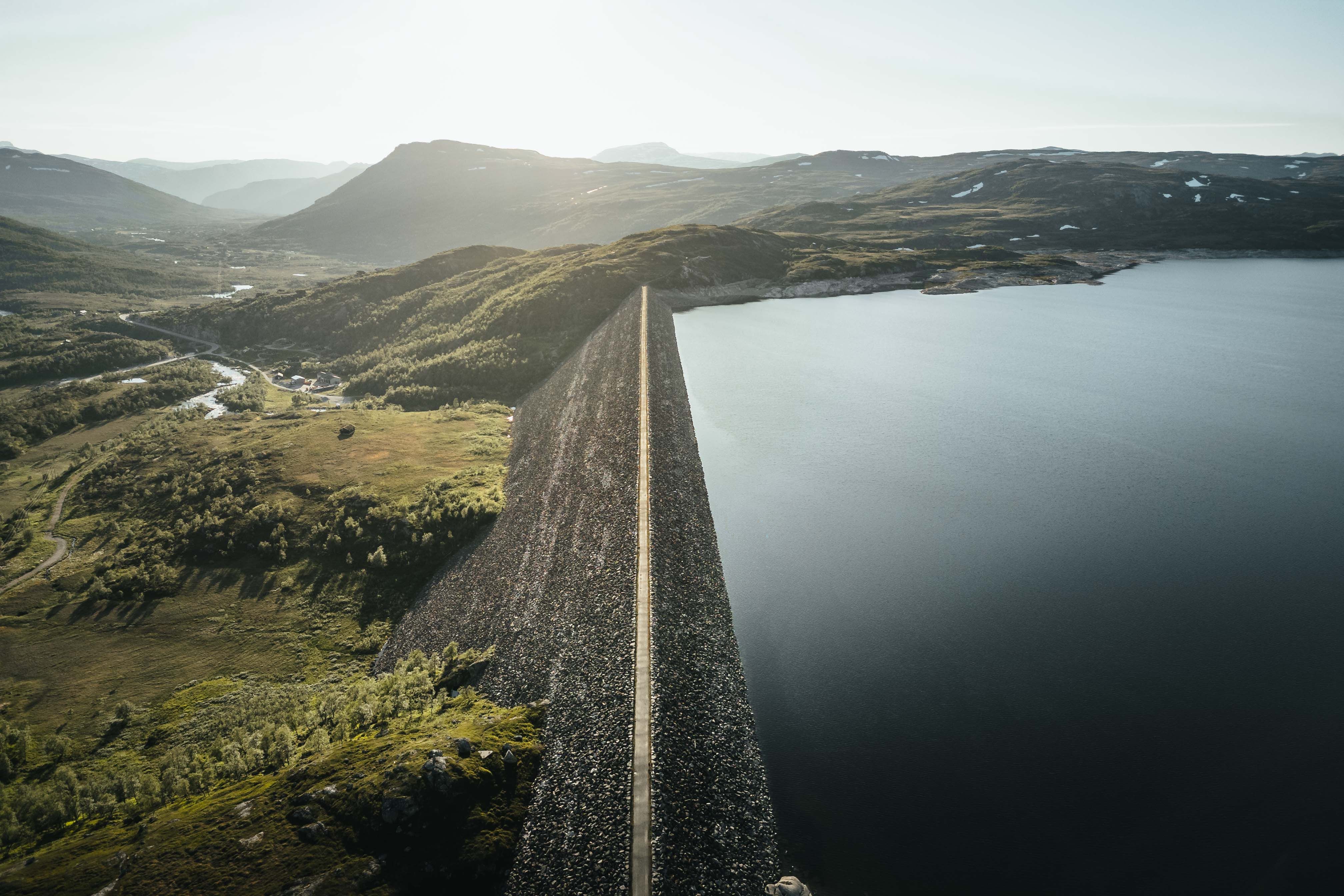 A drone photo of the Sysendammen dam during sunset.