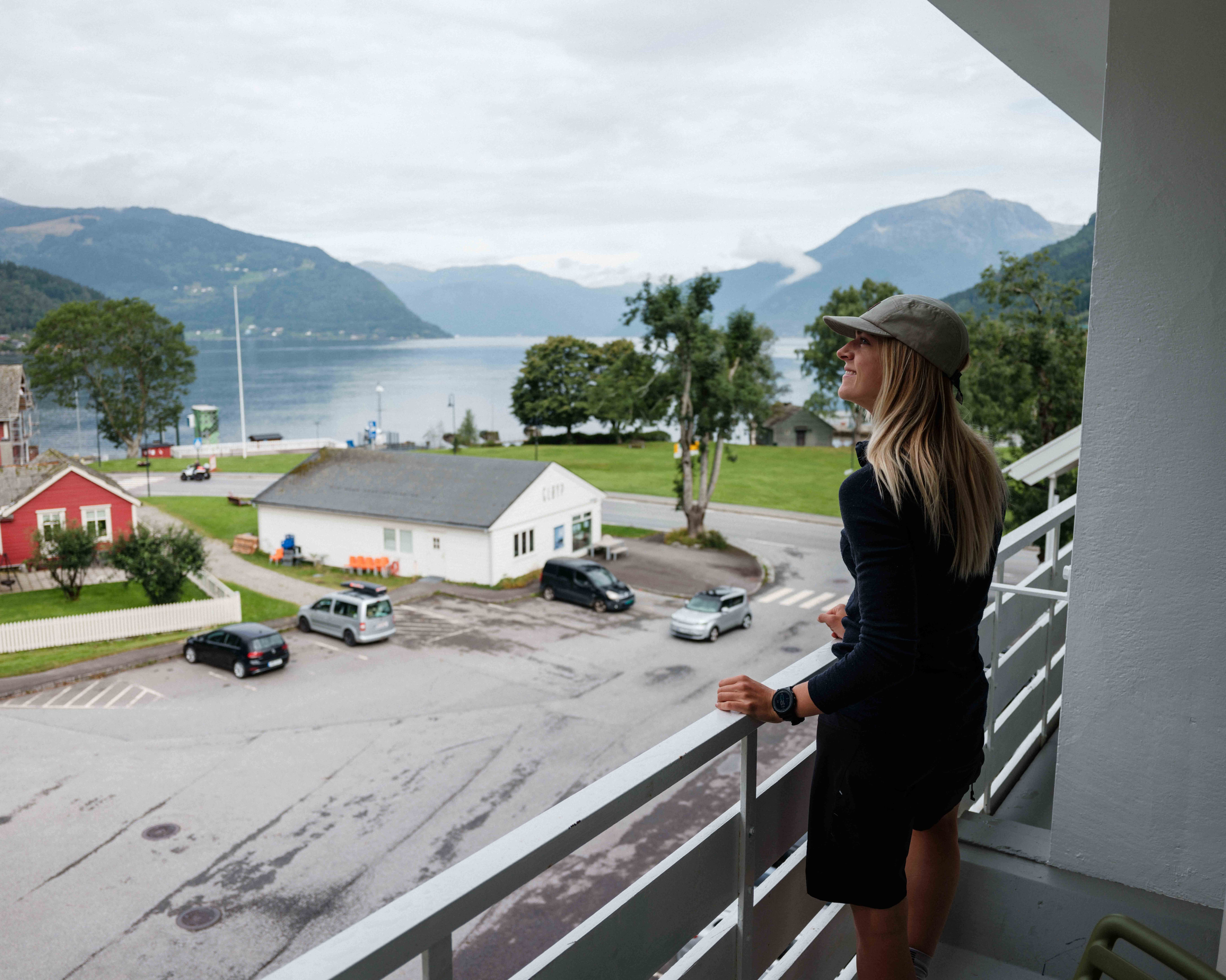Panoramic balcony view of the Hardangerfjord and surrounding mountains.