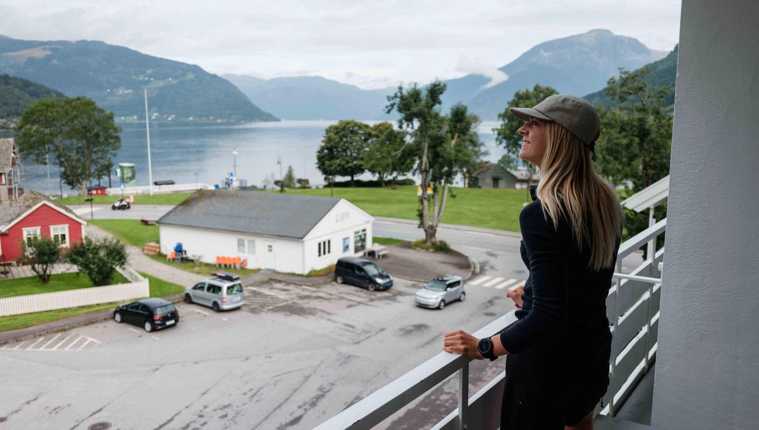 Panoramic balcony view of the Hardangerfjord and surrounding mountains.