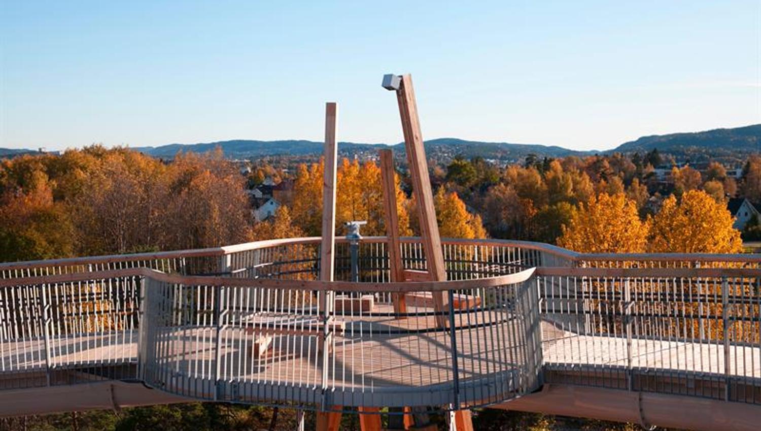 the stove tower with the forest in autumn colours behind