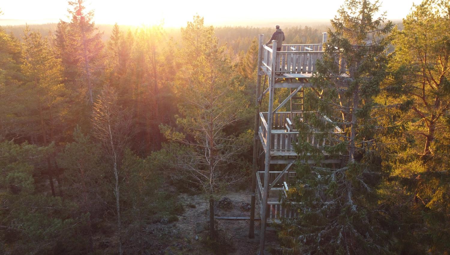 A visitor standing on the top of the tower