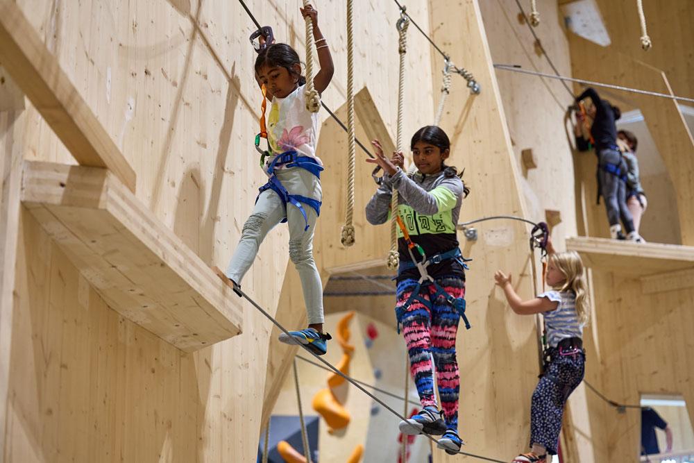children climbing on "Høyt under Taket" in Skien