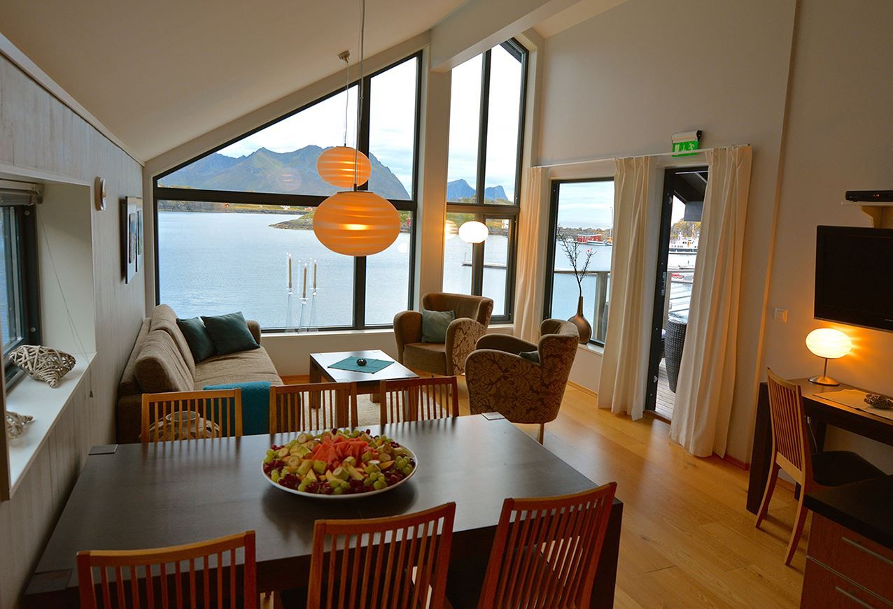 Interior of an apartment with views of the sea and mountains.