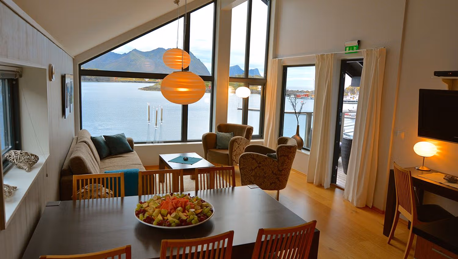 Interior of an apartment with views of the sea and mountains.