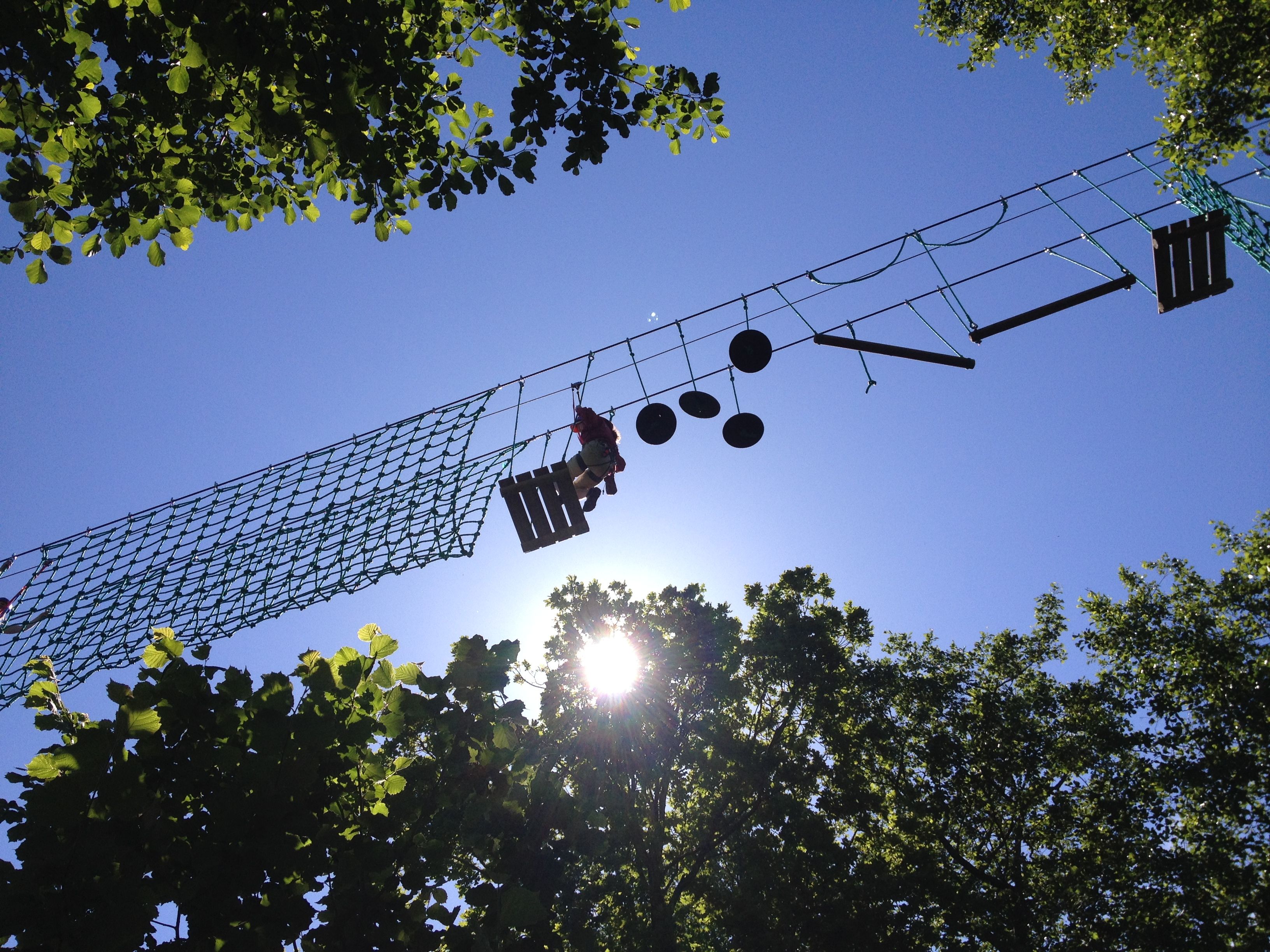 The climbing park seen from the underside up towards the sky