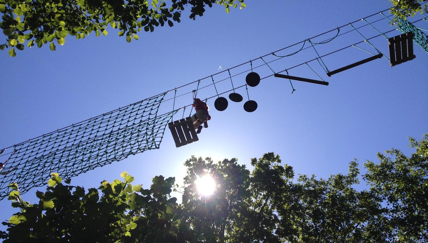 The climbing park seen from the underside up towards the sky