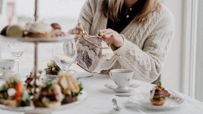 Poster for the event: a picture of someone pouring tea into a teacup.