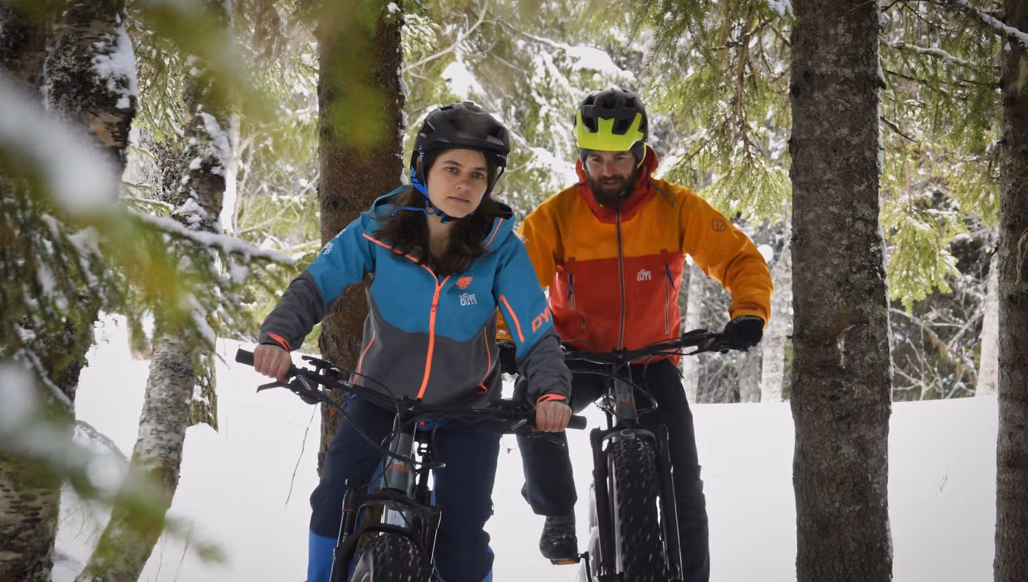 Two persons on fabikes in winter in Tromsø