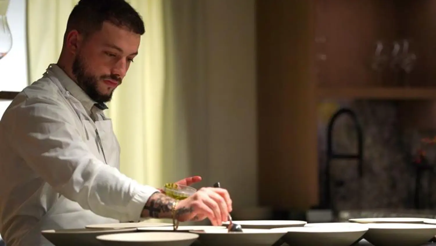chef putting food on plates