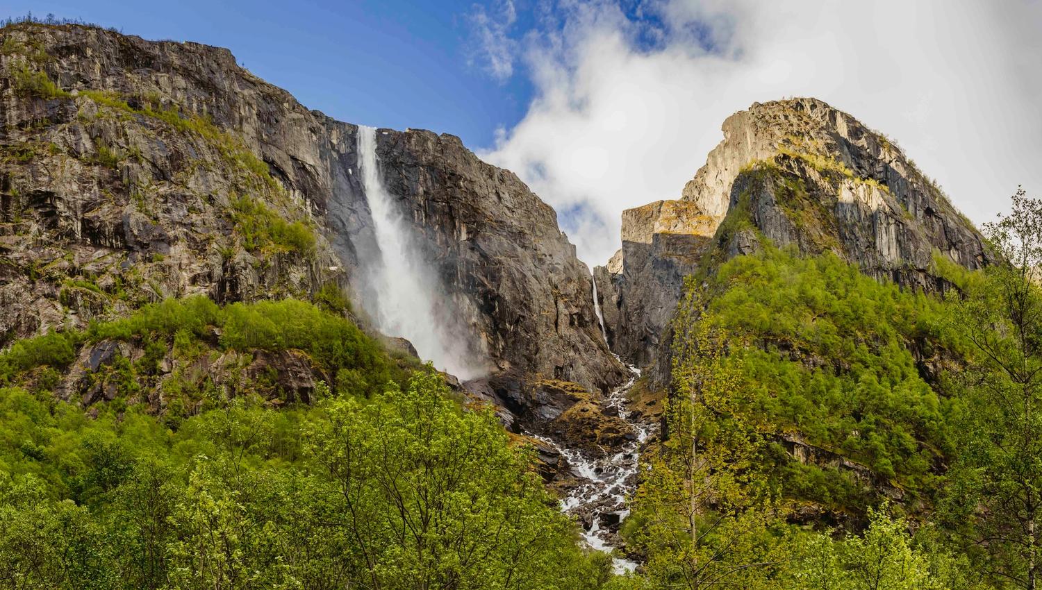 Skytjefossen waterfall seen from below.