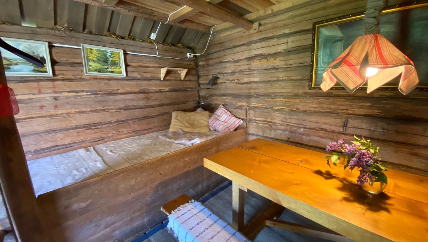 old livingroom with a bench and bed