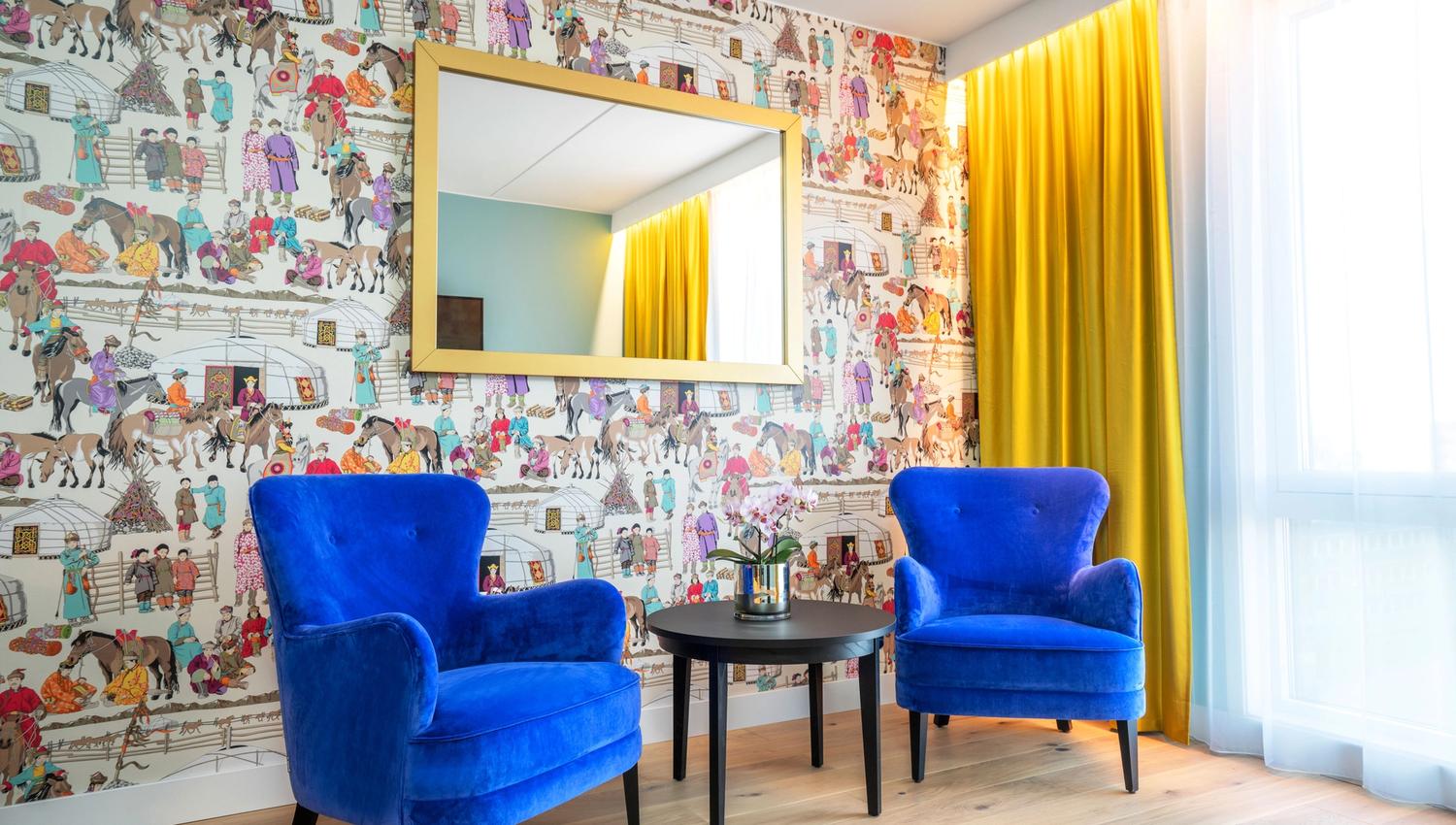 Two blue recliners, multi coloured wall. Thon Hotel Storo, Oslo. Photo