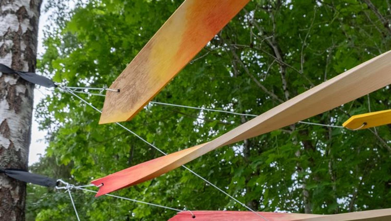 several planks in a tree artist Cathrine Kullberg «Mellom trær»