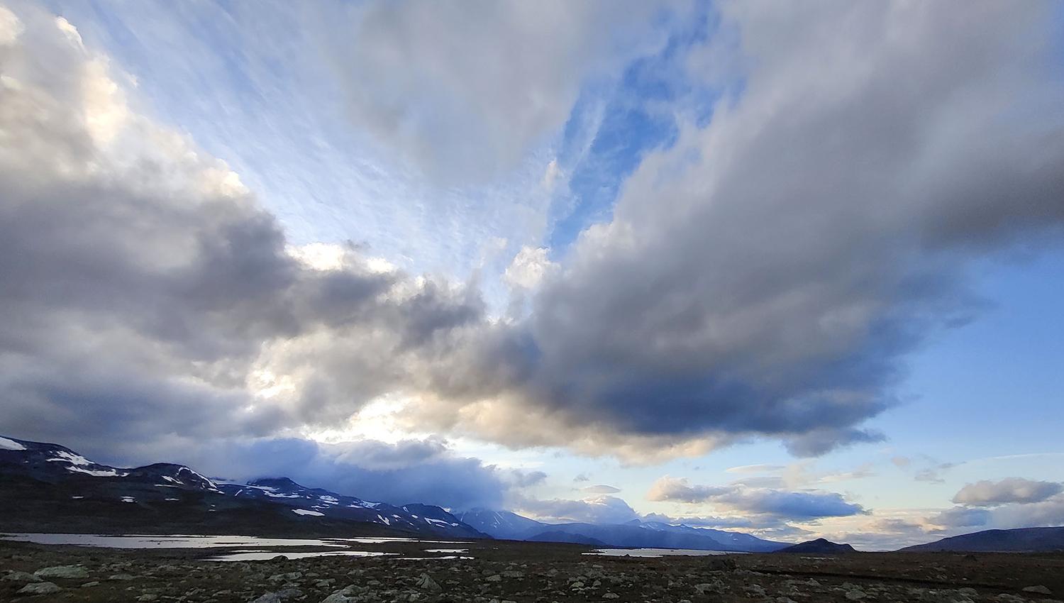Mountain plateau with lakes and high skies with lots of cool clouds and magical light