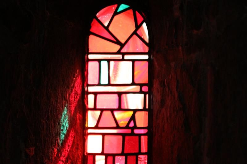 Colored glass windows set the light at Gamle Aker kirke
