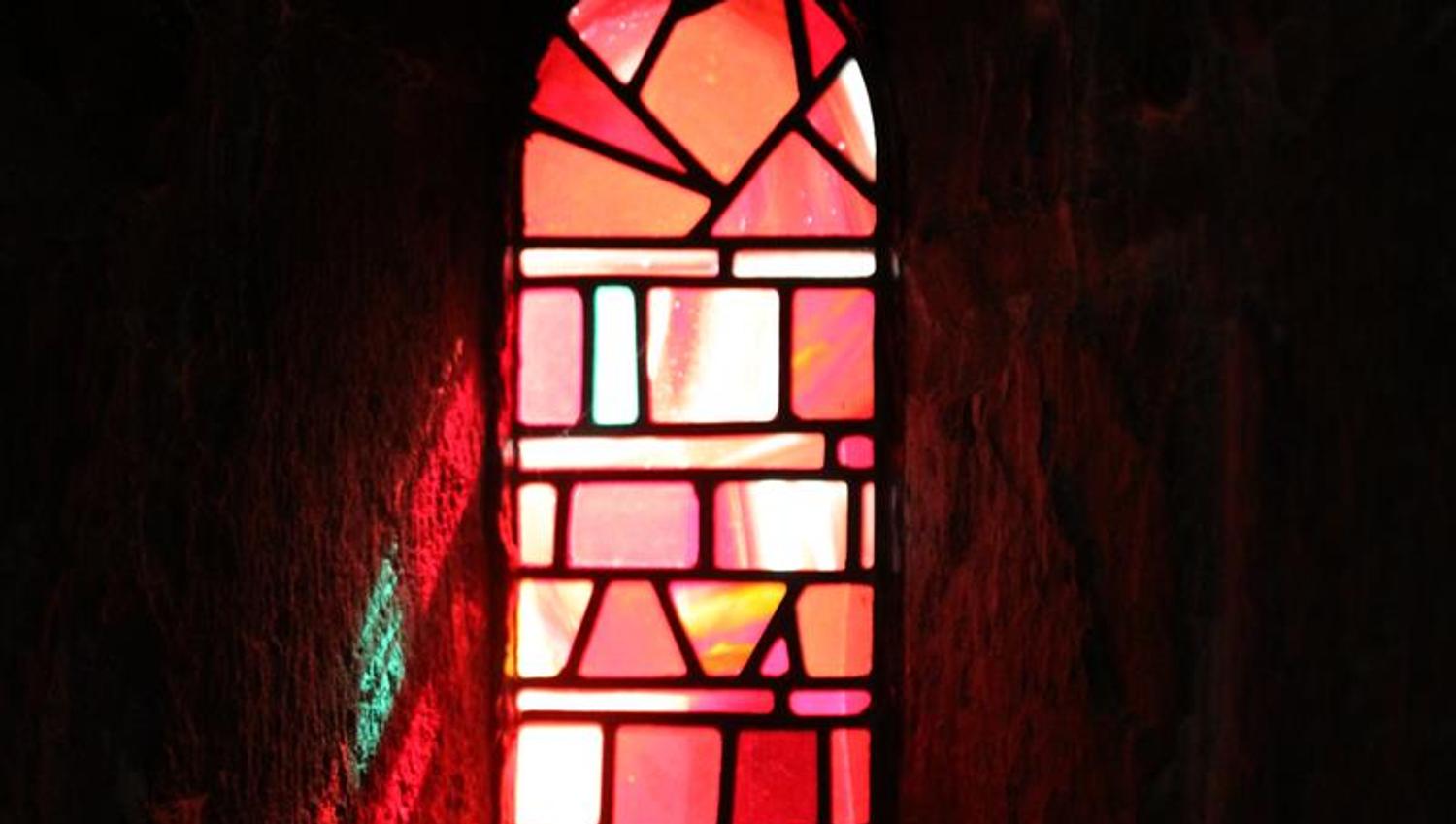 Colored glass windows set the light at Gamle Aker kirke