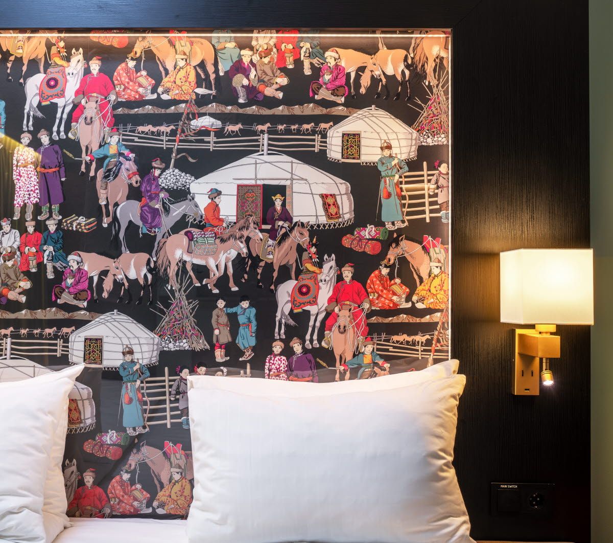 Detail photo of bed frame with illustrations on.