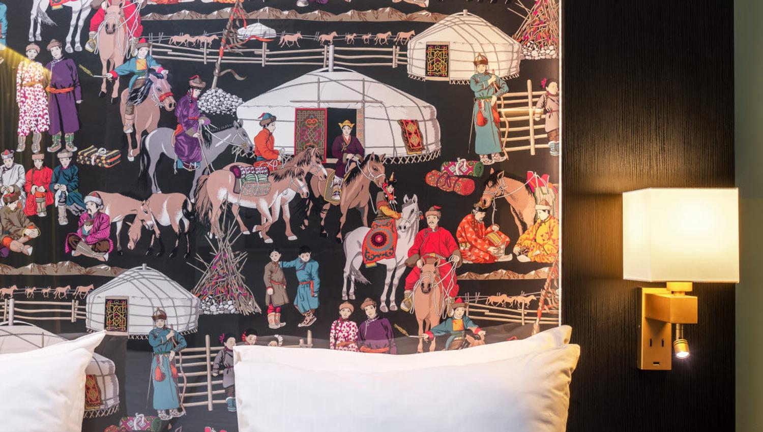 Detail photo of bed frame with illustrations on.