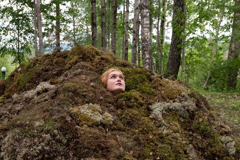woman looking up from a hole - art 