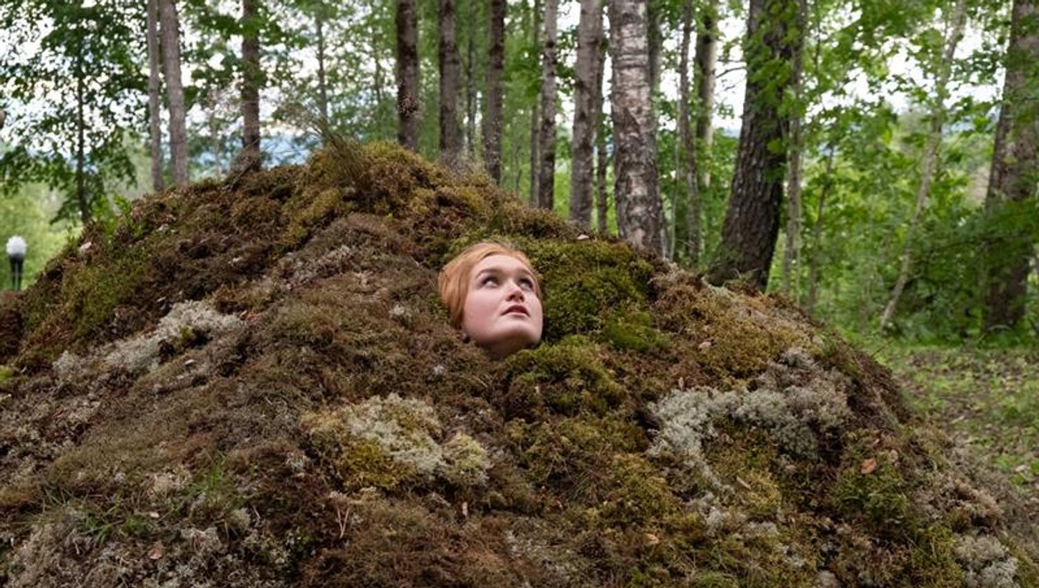 woman looking up from a hole - art