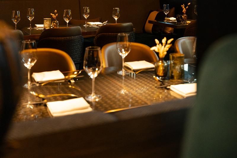 Tables set for dining and chairs