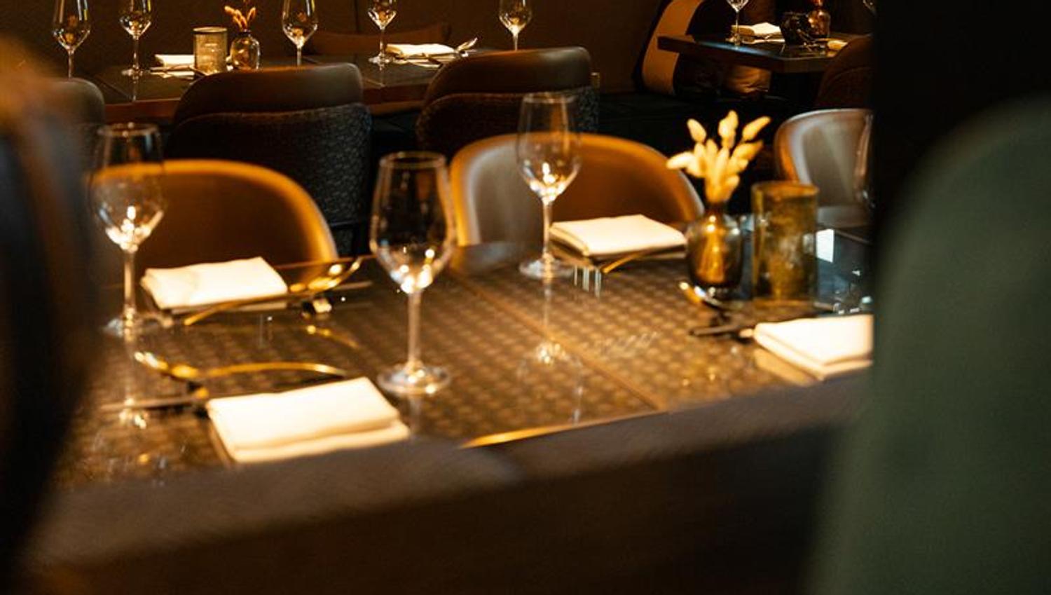 Tables set for dining and chairs